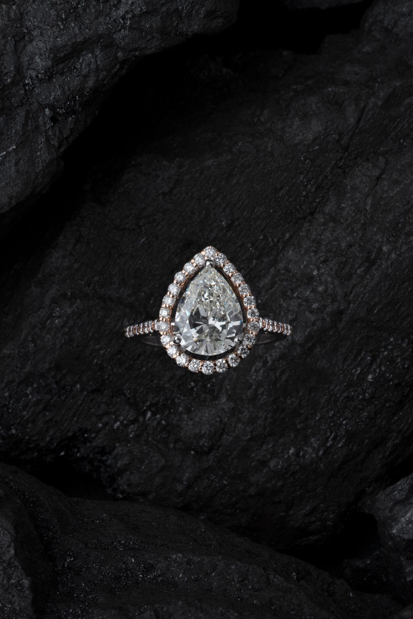 Pear-shaped diamond ring on black stone